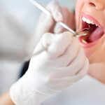 Dentist discussing dental care options with a patient in a dental office in Fort Lauderdale